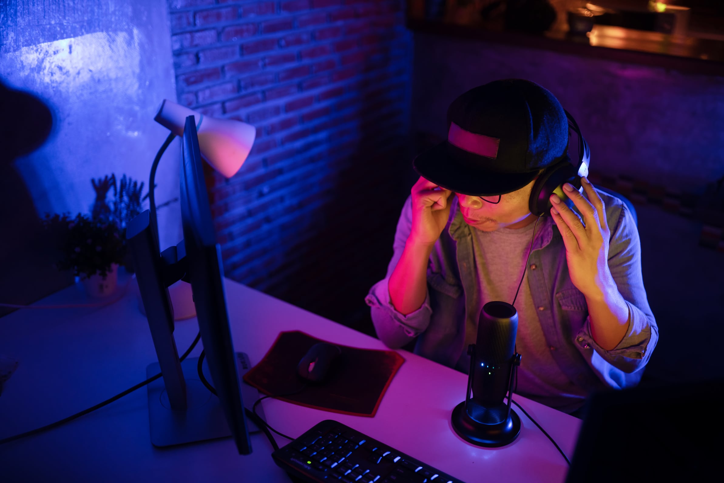 Young man content creator streaming virtual meeting